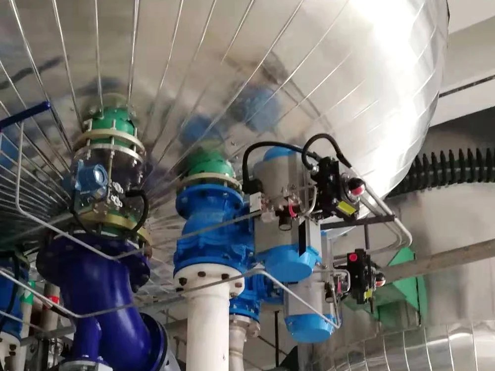 Pressure transmitter mounted on an insulated reactor vessel nozzle in a chemical plant, surrounded by actuated valves and insulated piping