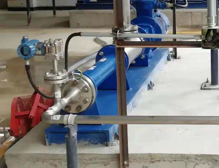 Blue-head pressure transmitter on a stainless manifold reading line pressure at a pump skid