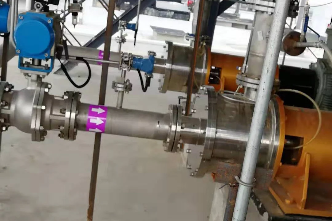 Pump discharge piping with an actuated valve, reducers and pressure instrumentation in an industrial plant