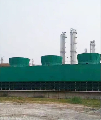 Induced-draft cooling towers with fan stacks at an industrial plant