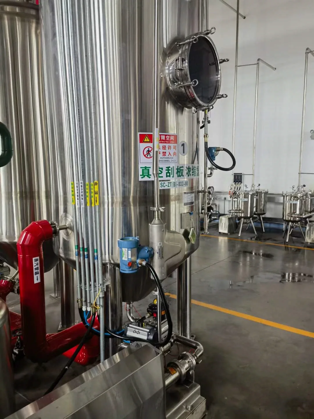Coriolis flow metering point on a stainless steel process skid