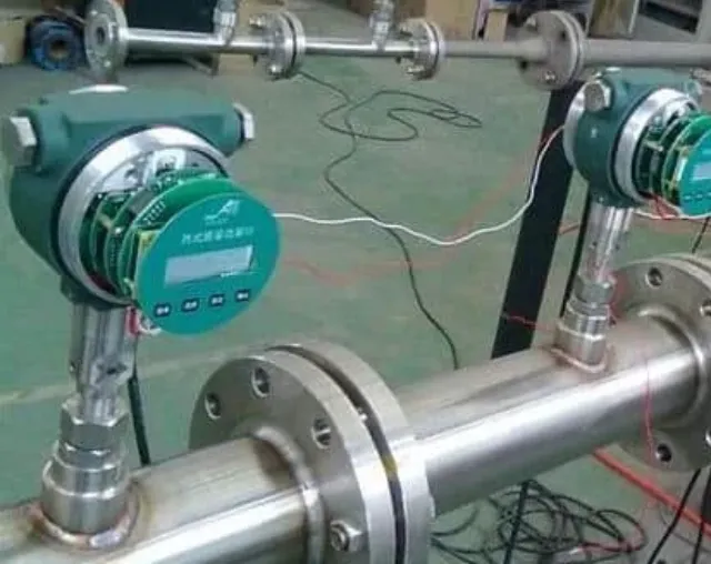Gas mass flow meters installed on a stainless steel compressed air test line with flanged connections