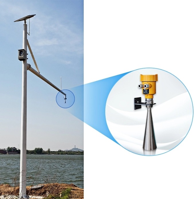 Solar-powered monitoring mast with a boom-mounted radar water level sensor over a reservoir