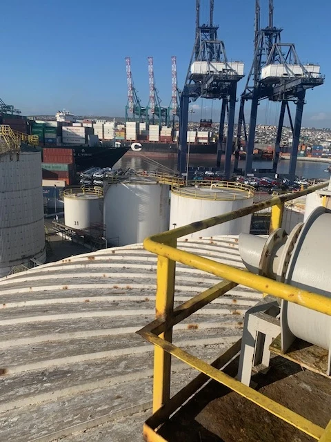 Bulk liquid terminal tank farm seen from the roof of a storage tank